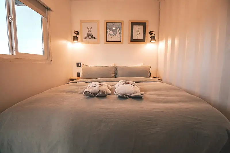 Cosy boutique hotel bedroom with warm lighting